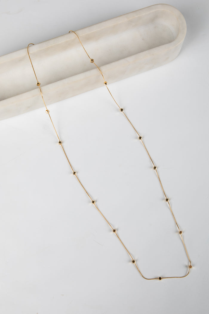Gold necklace on a white background