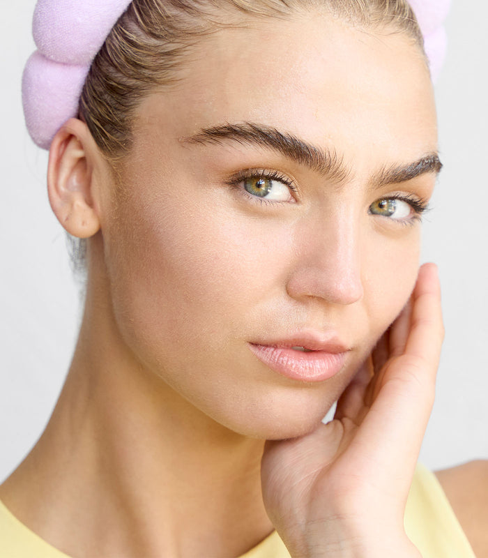 A close-up image of a person showcasing their skin, presumably to highlight the results of a skincare treatment.