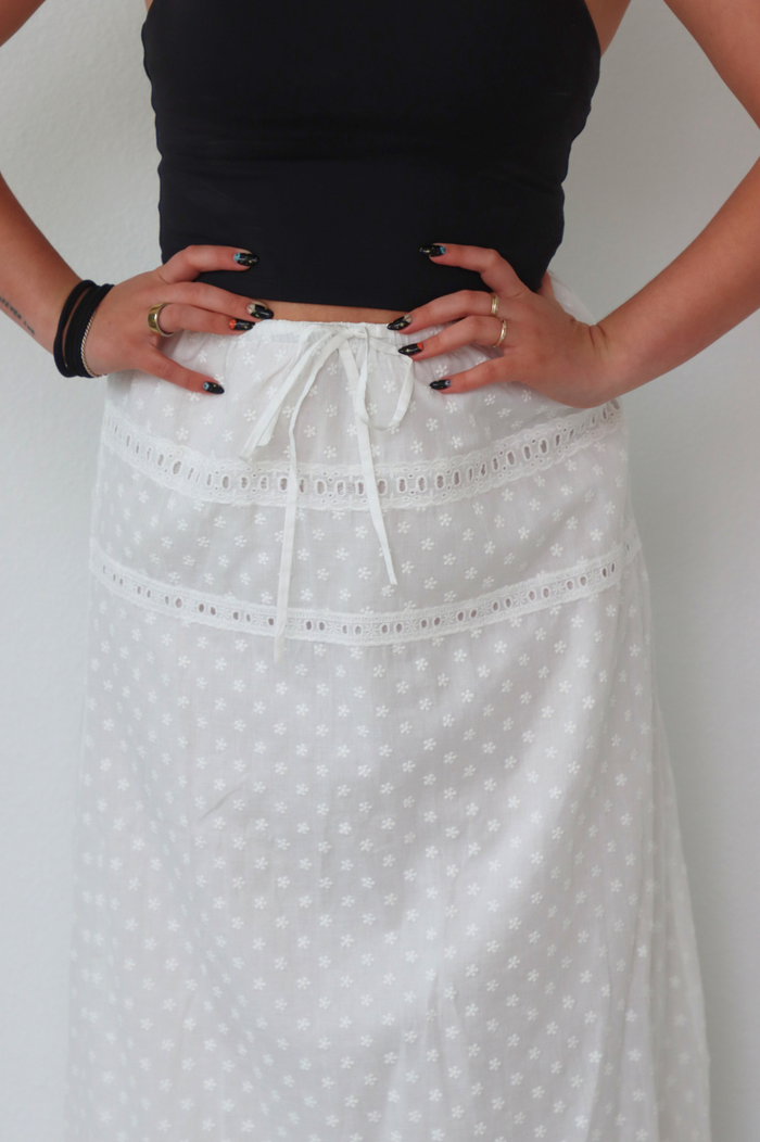 girl wearing white long skirt