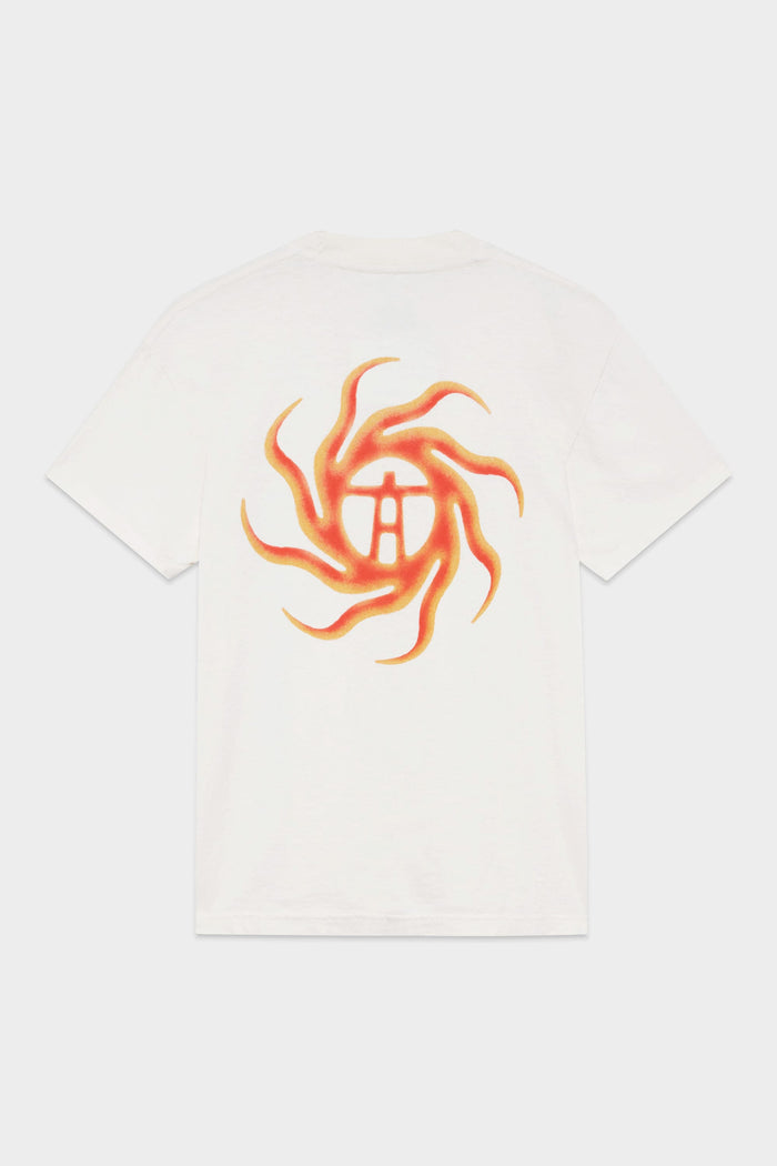 The 686 Mens Man in the Sun Short Sleeve Tee by 686 is a white T-shirt with a large orange and yellow swirling sun design and a stylized symbol at the center on the back.