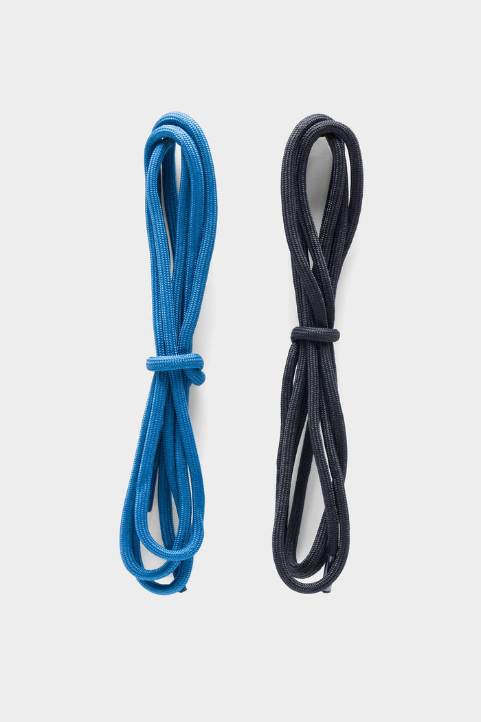 Two neatly coiled 686 x Rocky Boots Mens Summit Elite Boot laces are shown side by side on a white background, with the blue lace on the left and the black lace on the right.