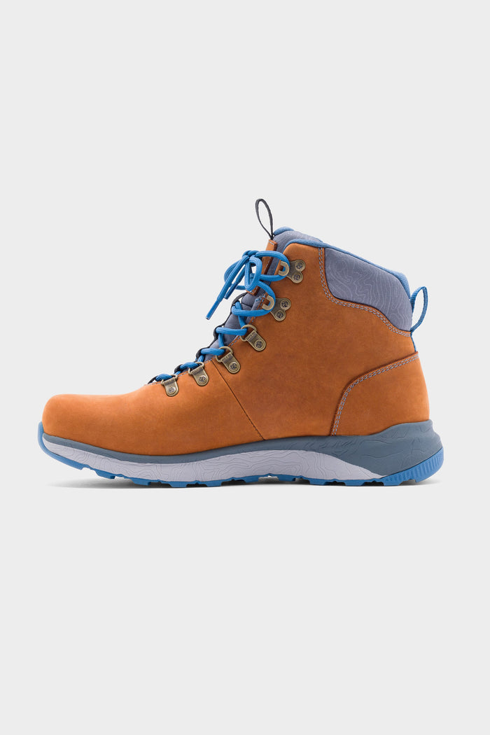 The 686 x Rocky Boots Mens Summit Elite Boot is shown in profile: a single brown boot with blue laces, blue ankle padding, and a blue and gray rubber sole, set against a plain white background.