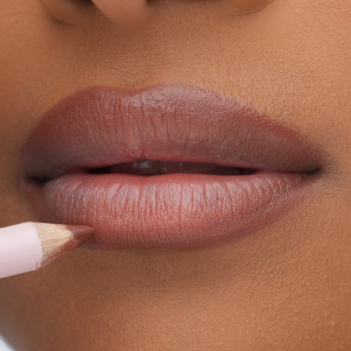 Pink Lipps Neutral Brown Everlasting Lip Liner swatch on medium to deep skin tone showing warm golden-brown pigmentation.