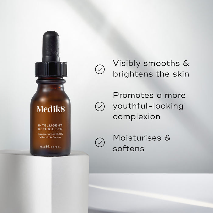 Medik8 Intelligent Retinol 3TR serum bottle stands on a white pedestal against a bright, neutral background. Text highlights that the product "Visibly smooths & brightens the skin," "Promotes a more youthful-looking complexion," and "Moisturises & softens."