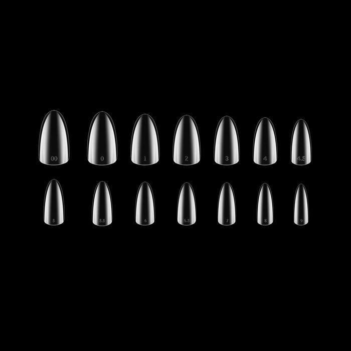 Set of clear nail tips on a black background