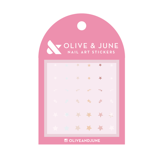 Package of SHIMMERY STARS nail art stickers in metallic gold, silver, rose gold, and white by Olive and June