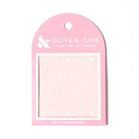 White Stars nail art stickers featuring various sizes of white stars on a soft pink backing for mani decoration